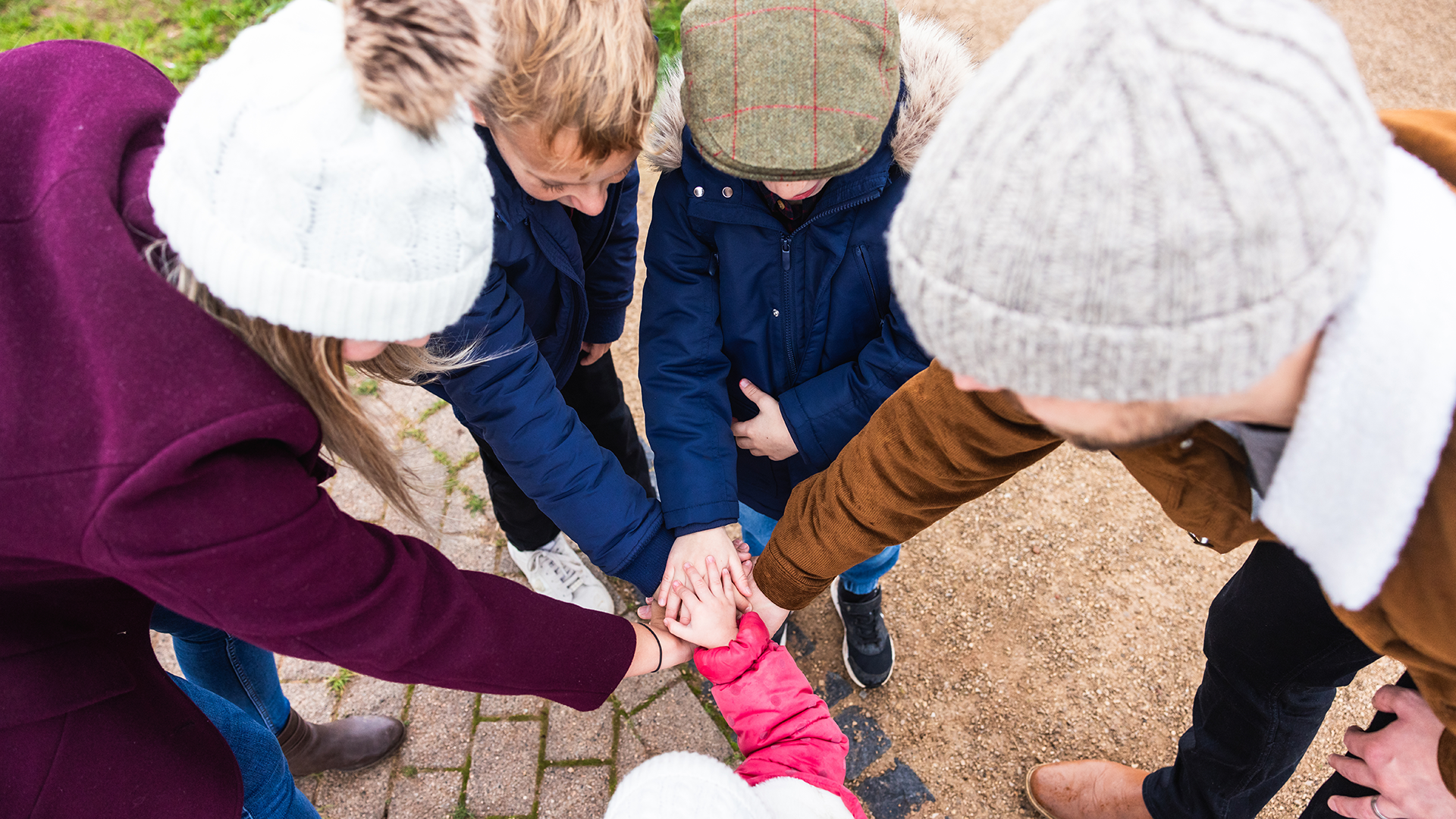 Image of parents and children supporting each other