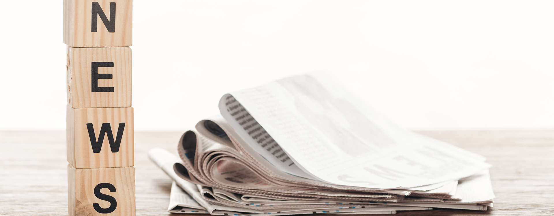 Image of wooden cubes with word news