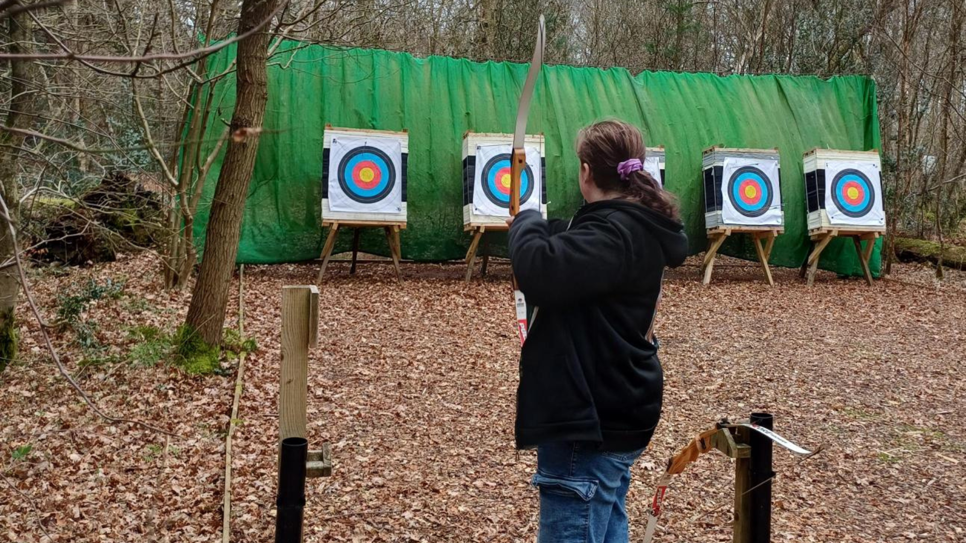 Image of a girl doing archery
