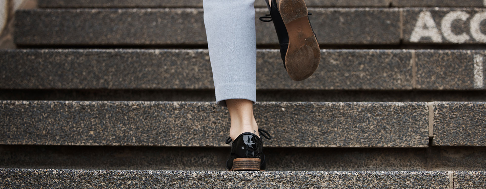 Image of feet walking up steps